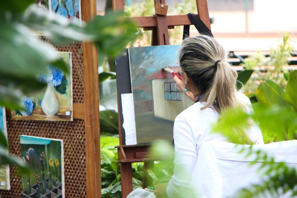 A woman painting on a canvas